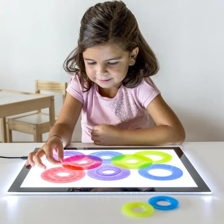 Anillos translúcidas colores y tamaños surtidos 16pzas para mesa de luz<Miniland Online